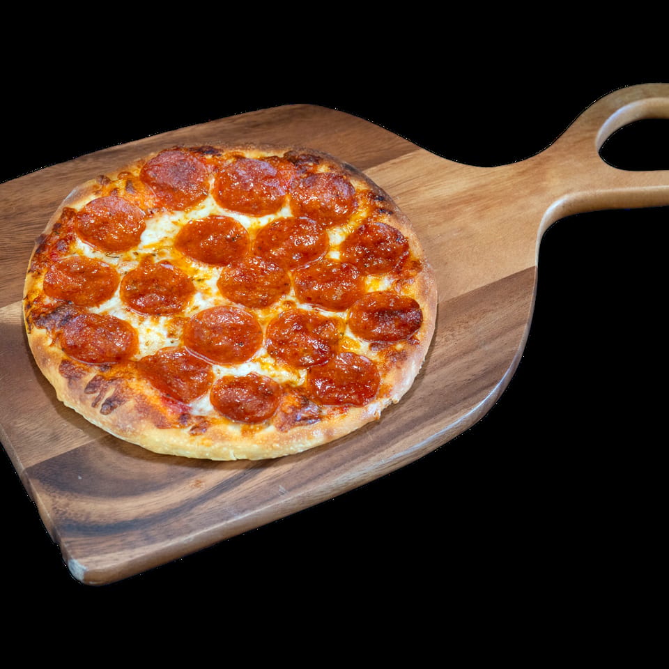 A small, round pepperoni pizza with melted cheese on a wooden pizza peel.